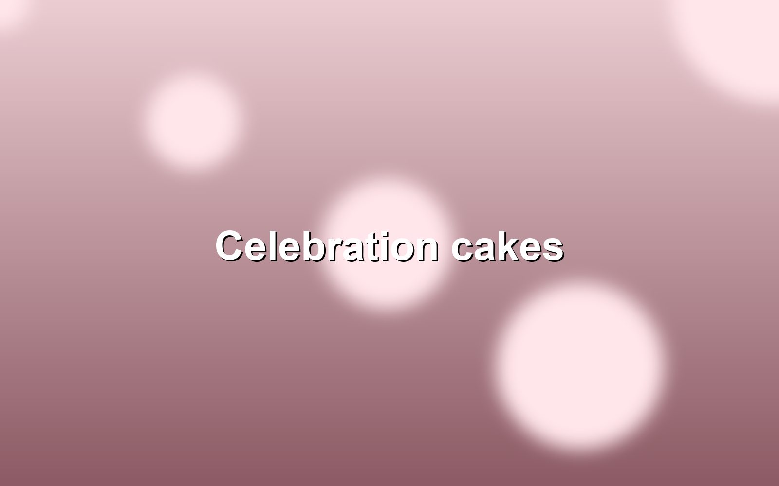 A three-tier celebration cake with fresh flowers